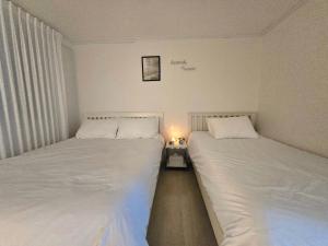 Ένα ή περισσότερα κρεβάτια σε δωμάτιο στο Rinn Stay - Bongcheon Station, Seoul National Uni, Airport Bus