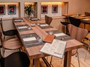 a conference room with a long table with music on it at ibis Lima Larco Miraflores in Lima