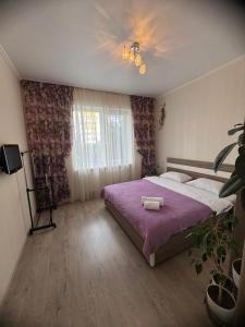 Ένα ή περισσότερα κρεβάτια σε δωμάτιο στο Domik