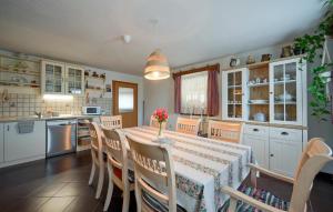 a kitchen with a table and chairs in a kitchen at 3 Bedroom Beautiful Home In Novi Marof in Novi Marof