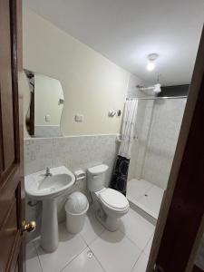 a bathroom with a toilet and a sink at Hospedaje Catalina in Pisac +84 photos