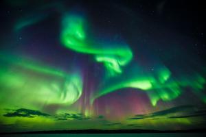 an image of the northern lights in the sky at Villa Aattu in Muonio