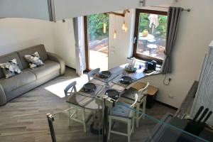 a living room with a glass table and a couch at Domus Minerva in Massa Lubrense