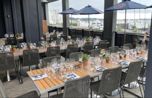 a group of tables and chairs in a restaurant at Hammetts Hotel in Newport