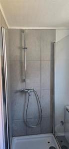 a shower with a glass door in a bathroom at deSoL in Forst +32 photos