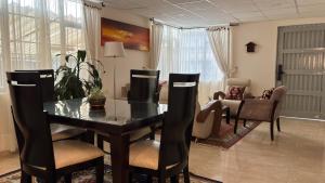 a dining room with a table and chairs at Casa Boutique Familia Hurtado in Manizales