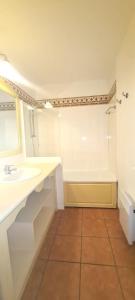a bathroom with a sink and a bath tub at Apartment with view in Roquebrune-sur-Argens in Roquebrune-sur-Argens +5 photos