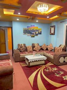 a living room with couches and a table at Mountain view Escape in Kathmandu