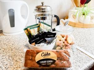 a counter top with a bag of food and a blender at Ivy Cottage in Newchurch