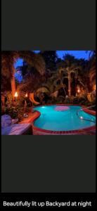 a picture of a swimming pool at night at Private studio with pool and a jacuzzi near beach in Fort Lauderdale