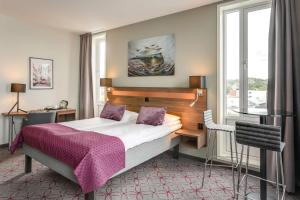 a hotel room with a bed and a window at Scandic Syv Søstre in Sandnessjøen +96 photos