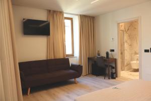 Μια τηλεόραση ή/και κέντρο ψυχαγωγίας στο B&B Tower Suite Trento +14 φωτογραφίες