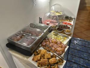 a buffet with many different types of food on a table at Badia Rooms & Breakfast in Castellammare del Golfo +66 photos