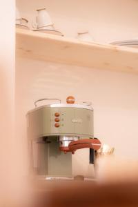 a sewing machine sitting on a shelf at Tirituffo - B&B di campagna in Soveria Mannelli +28 photos