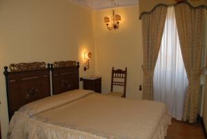Cama ou camas em um quarto em Hotel Villa Palocla
