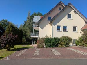 a house with a solarium on the side of it at Ferienwohnung Familie Baus in Hammelburg