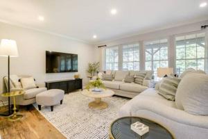 a living room with a couch and a table at Serene 3 bedroom home in Apex in Apex
