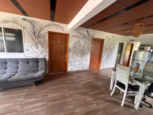 a living room with a couch and a table at Maracuya Hostel in San Rafael