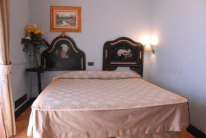 Cama ou camas em um quarto em Hotel Villa Palocla