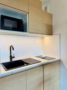 Η κουζίνα ή μικρή κουζίνα στο Le Saint Jean, Ouest de Rennes, avec balcon et stationnement