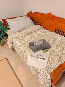 Ένα ή περισσότερα κρεβάτια σε δωμάτιο στο Choon home Chiangmai