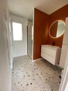 a bathroom with a sink and a mirror at L'Escale - Charming Seaside house by Harbor in Cancale +11 photos