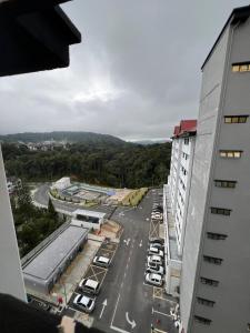 an aerial view of a parking lot with cars parked at Highland Chill Retreat in Tanah Rata