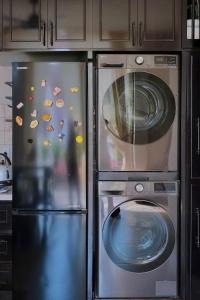 a kitchen with two refrigerators with fish on them at HIDE&SEEK Homestay in Ấp Tân An (1)