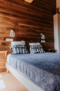 Postel nebo postele na pokoji v ubytování Alphonsine Ski Lodge