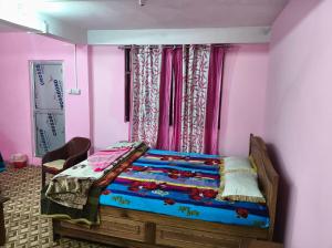 Giường trong phòng chung tại Tulip Nest Homestay