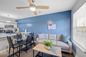 a living room and kitchen with a couch and a table at Chic Modern Suite With Style I Free Parking in Spring Lake