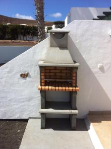 a stairway with a shelf on the side of a wall at Eduval in Yaiza +3 photos