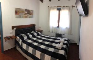 Ένα ή περισσότερα κρεβάτια σε δωμάτιο στο Hotel Malva