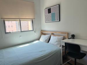 Ένα ή περισσότερα κρεβάτια σε δωμάτιο στο Mercado del Carmen Living +9 φωτογραφίες