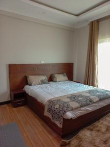 Ένα ή περισσότερα κρεβάτια σε δωμάτιο στο 19&G Apt