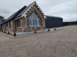 a brick building with a window on the side of it at The Barn in Clonmel