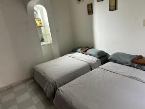 Postel nebo postele na pokoji v ubytování caipiriñas mix