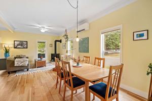 a dining room and living room with a table and chairs at North Bozeman Oasis in Bozeman