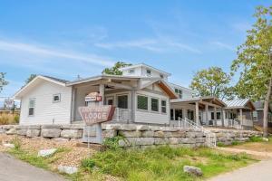 a house with a for sale sign in front of it at Lighthouse Lodge 4 in Kimberling City