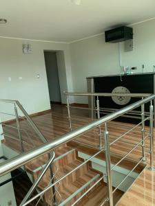 an empty room with a metal railing and stairs at Hotel Huancayo - El Toro Wanka in San Antonio
