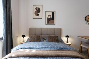 Ένα ή περισσότερα κρεβάτια σε δωμάτιο στο MW 6 Apartament
