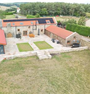 an aerial view of a house with a large yard at The Barn, Luxury Country Home Sleeps 6 Hot Tub Near Durham City & Bishop Auckland in Durham