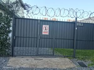 a black fence with a no smoking sign on it at Relax1 in Paysandú