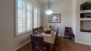 a dining room with a table with a bowl of fruit on it at LV252 Private Upstairs 2BD-2BA Legacy Villas Condo in La Quinta