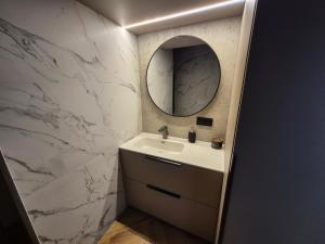 a bathroom with a sink and a mirror at Marių namai in Kaunas +71 photos