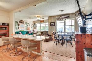 a kitchen and living room with a table and chairs at Walk to Marina Family Home with Yard in Kingston in Shay
