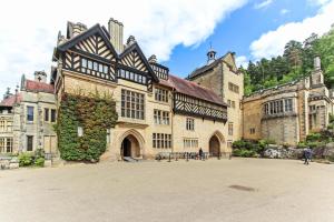 a large building with people standing in front of it at Elmsleigh Nest in Rothbury