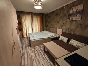 Postel nebo postele na pokoji v ubytování Orbi Palace Delux A + 16 fotografií