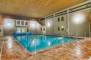 a large swimming pool in a hotel room at Ski-InandSki-Out Condo in Upson - Walk to Lake in Upson