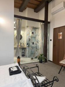 a room with a bed and a glass wall at Hotel Plzeňský Dvůr in Frýdek-Místek +104 photos